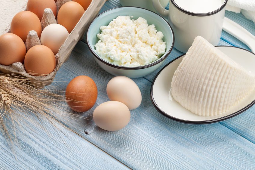 43704972 - dairy products on wooden table. sour cream, milk, cheese, eggs and yogurt